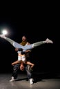 hip-hop dancers male and female showing different tricks and movements while dancing in studio Royalty Free Stock Photo