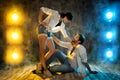 Hip hop Dancing Couple. Happy Smiling Modern Break Dancer in white Shirt and Jeans. Sexy Man and Woman dance over Grunge Royalty Free Stock Photo