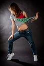 Hip hop dancing girl on a dark background Royalty Free Stock Photo