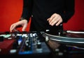 Hip hop dj plays music on party with turntables and audio mixer Royalty Free Stock Photo