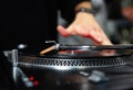 Hip hop dj scratches record on turn table device Royalty Free Stock Photo