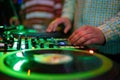 Hip hop dj scratches vinyl record on turn table. Professional disc jockey scratching records with turntable and sound mixer Royalty Free Stock Photo