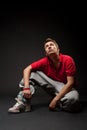 Hip-hop man sitting on the floor Royalty Free Stock Photo