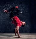 Hip-hop style dancer performs breakdance acrobatic elements. Royalty Free Stock Photo