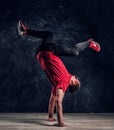 Hip-hop style dancer performs breakdance acrobatic elements. Royalty Free Stock Photo