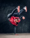 Hip-hop style dancer performs breakdance acrobatic elements. Royalty Free Stock Photo