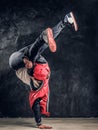 Hip-hop style dancer performs breakdance acrobatic elements. Royalty Free Stock Photo