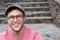 Hip man smiling wearing eyeglasses and hat Royalty Free Stock Photo