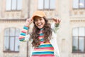 Hip and stylish. pretty child smiling outdoor. kid beauty and fashion. cheerful school girl wear cap. teen in casual Royalty Free Stock Photo