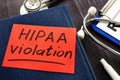 Hipaa violation inscription on a piece of paper