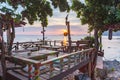 Hippie bar on a cliff over the sea in the sunset