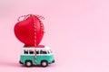 Riga, Latvia, January 22 2019. Hippie Bus with Red Heart on the Roof Valentines Day Miniature Small Car Banner Love Theme