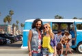 Hippie couple over minivan at venice beach in la Royalty Free Stock Photo