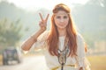 Hippie girl with peace signs Royalty Free Stock Photo