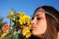 Hippie girl smells lily Royalty Free Stock Photo