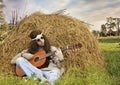 Hippie man playing guitar outdoors Royalty Free Stock Photo