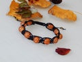 Hippie orange bracelet and leafs