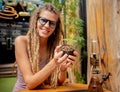 Hippie style woman growing medical marijuana bush