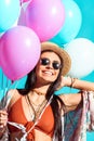 Hippie woman holding colored balloons Royalty Free Stock Photo