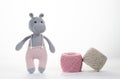 Hippo doll made of yarn. Colorful balls of yarn. Yarn and thread production concept. Needlework, textiles. Copy space