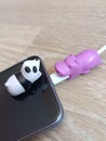 Hippo and panda cable protectors Royalty Free Stock Photo