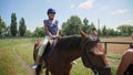 Hippotherapy rehabilitation deals with child riding on horseback