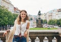 Hippy-looking woman tourist standing on Wenceslas Square, Prague