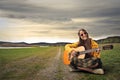 Hippy teenager playing the guitar