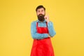 Hipster in apron thinking about recipes. Easy to cook recipes. Unique healthy recipes. Plan weekly meals. Cooking Royalty Free Stock Photo