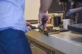 Hipster barista using tamper making perfect fresh professional coffee