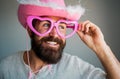 Hipster with beard and mustache in funny big eyeglasses. Happy man smile face. Handsome smiling young guy. Positive Royalty Free Stock Photo