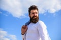 Hipster beard mustache looks puzzled frustrated. Man bearded hipster formal style look back sky background. Frustration