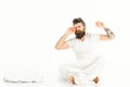 Hipster with beard and mustache stretching arms, sleepyhead. Royalty Free Stock Photo