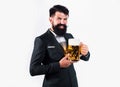 Hipster with beard and mustache in suit drinks beer after working day. Germany Bavaria. Beer time. Barman holding a pint Royalty Free Stock Photo