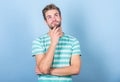 Hipster bearded face not sure in something. Thoughtful man on blue background. Thoughtful expression. Need to think