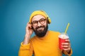 Content man with headphones and drink Royalty Free Stock Photo