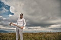 Hipster in sunglasses with axe stand on mountain landscape Royalty Free Stock Photo