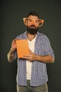 Hipster bearded man wear funny eyeglasses hold notepad or book. Bright up your day. Read this book. Comic and humor Royalty Free Stock Photo