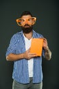 Hipster bearded man wear funny eyeglasses hold notepad or book. Bright up your day. Read this book. Comic and humor