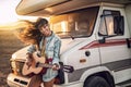 Hipster beautiful woman playing guitar with big smile on her face. Royalty Free Stock Photo