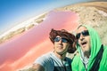 Hipster best friends at Walvis Bay pink salines in Namibia