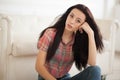 Hipster Woman sitting near white leather sofa