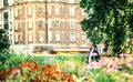 Hipster businessman with smartphone walking in park in London.