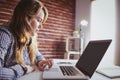 Hipster businesswoman using her laptop Royalty Free Stock Photo