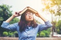 Hipster charming girl relaxing in the park while read book, Enjoy nature around Royalty Free Stock Photo