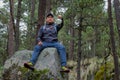 Hipster - a climber wear face mask rests on the top of a rock