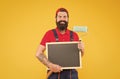 hipster with copy space on board. repair and building. craftsman on construction. creativity. reconstruction advertising Royalty Free Stock Photo