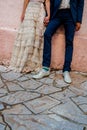 A hipster couple bride and groom with coloured funky socks and a vintage wedding dress Royalty Free Stock Photo