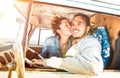 Hipster couple ready for roadtrip on oldtimer mini van transport Royalty Free Stock Photo