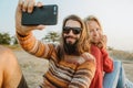 Hipster couple in sweaters making selfie outdoors Royalty Free Stock Photo